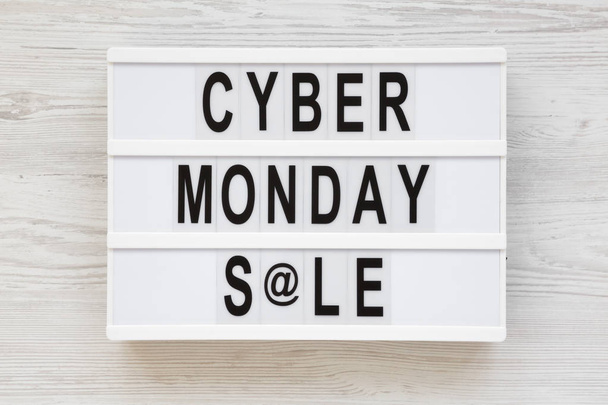 'Cyber monday sale' words on a modern board on a white wooden su - Photo, Image
