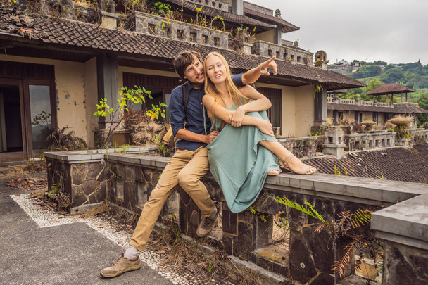Happy couple in love in abandoned and mysterious hotel in Bedugul. Indonesia, Bali Island. Honeymoon in Bali - Фото, изображение