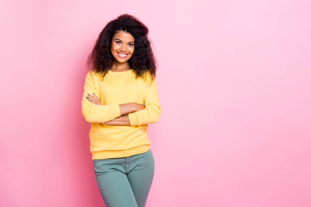 Portrait of positive cheerful friendly african girl entrepreneur cross her hands look enjoy her job colleagues wear yellow pullover pants isolated over pastel color background - Foto, Imagem