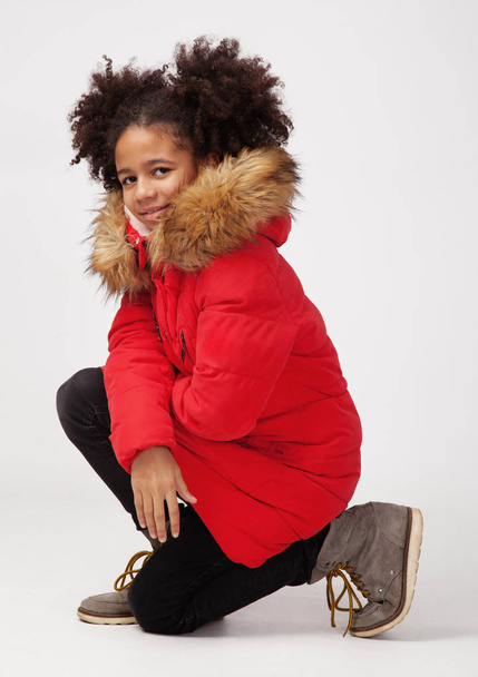 Cute teenage girl in red winter parka - Photo, image