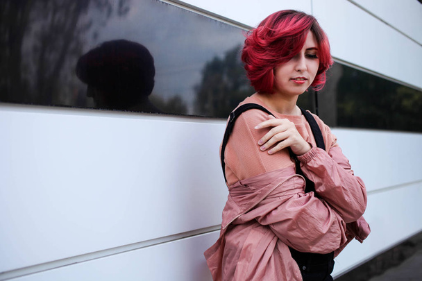 Girl with short pink hair in autumn clothes  - Valokuva, kuva
