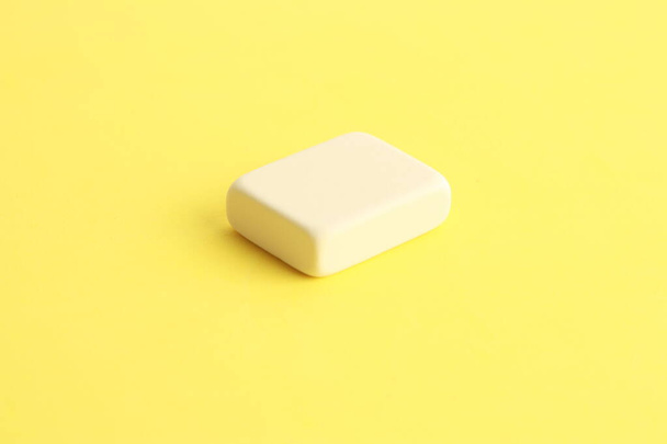 white eraser on color background - Фото, изображение