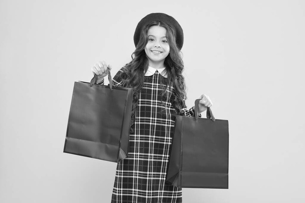 Shopping day. Child hold package. Favorite kids brand. Girl with shopping bag. Save money. Live better. Rediscover great shopping tradition. Shopping and purchase. Black friday. Sale discount - Foto, Imagem