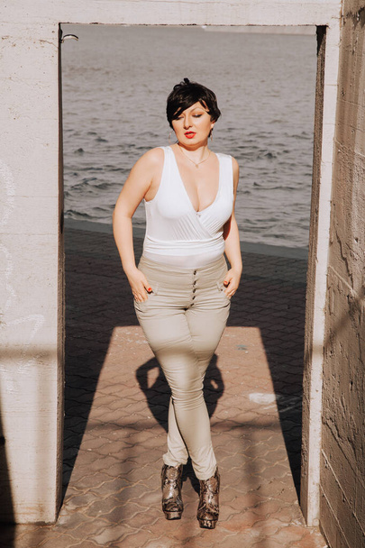 confident overweight woman walking the city street - Fotó, kép