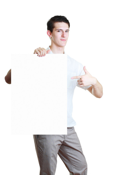 Young man holding blank white card - Zdjęcie, obraz