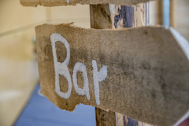 Wooden sign with the German inscription bar - 写真・画像