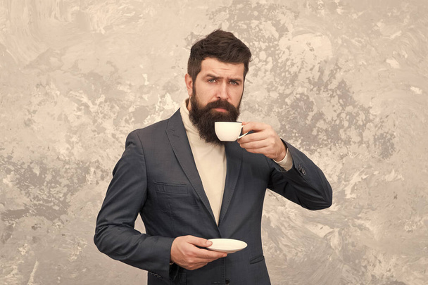Tailor or fashion designer. Male fashion model. Mature businessman. elegant man with beard drink coffee. Modern life. Brutal bearded hipster in formal suit. perfect breakfast. Businessman at work - Фото, изображение