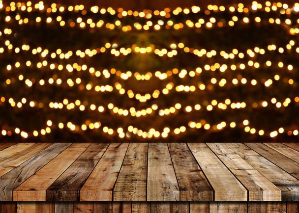 Floor of wooden table and Christmas bokeh background. - Photo, Image