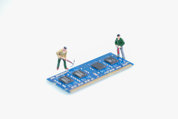 Miniature workmen working on the computer RAM or Random Access Memory component - Photo, Image
