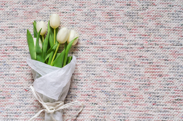 Bouquet of white tulips on textile background - Photo, Image