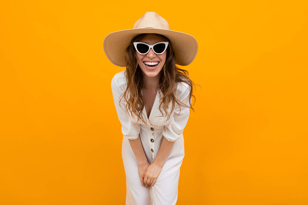 woman in hat posing on orange background  - Photo, Image