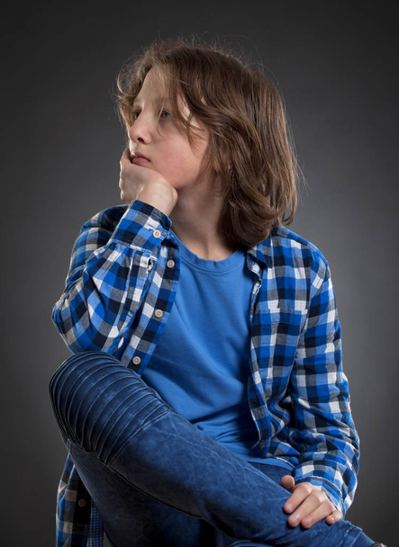 Portrait of a Boy with Brown Hair Outdoors. - Zdjęcie, obraz
