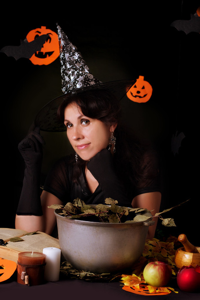 Witch practicing sorcery at Halloween night - Photo, Image