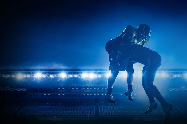 American football players on stadium in action - Фото, изображение