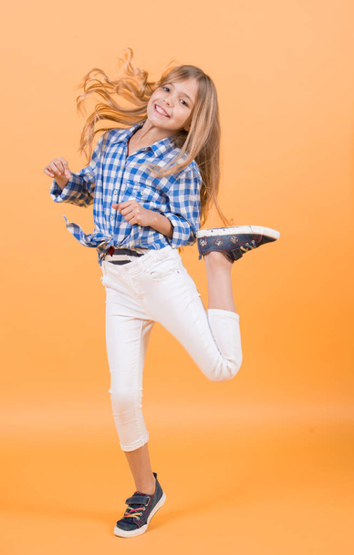 Girl child smile and jump with blond long hair - Фото, зображення