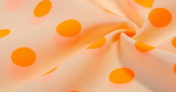 strukturierter Hintergrund, orangefarbener Tupfen-Seidenstoff. so vielseitig - Foto, Bild