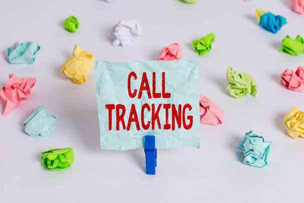 Handwriting text Call Tracking. Concept meaning Organic search engine Digital advertising Conversion indicator Colored crumpled papers empty reminder white floor background clothespin. - Photo, Image