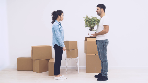 Strong woman is carring large moving boxes, full of items, isolated on white background. Copy space. Animation. Action. 4K. - Footage, Video