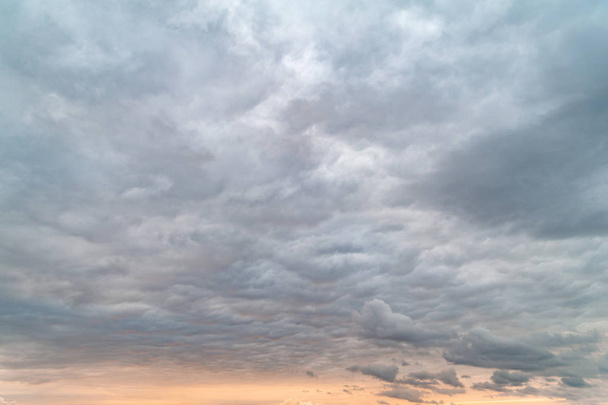 Dark clouds. Sky with lead-gray clouds in the evening at sunset. - Photo, Image