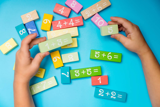 colored cubes with numbers hands - Photo, image