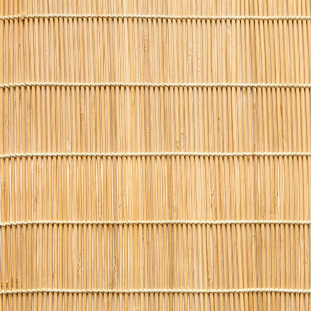 square background of wooden mat woven from sticks - Φωτογραφία, εικόνα
