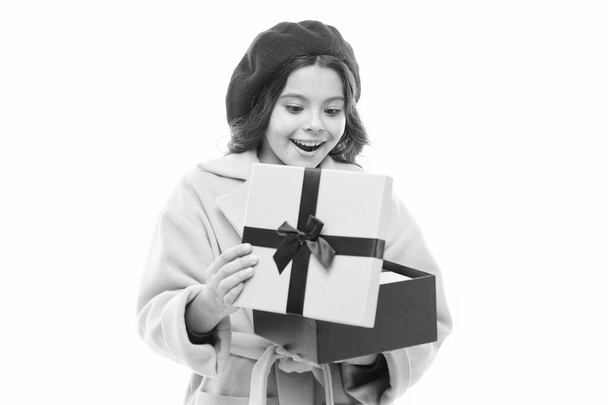 Astonished kid. Girl cute little lady coat and beret carry gift. Spring shopping concept. Buy clothes and cute little gifts for spring season. Satisfying shopping day. Child stylish hold gift box - Photo, image