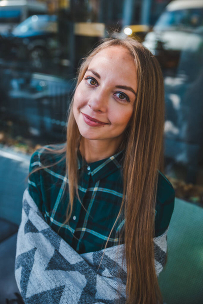 portrait of young smiling woman looking at camera casual clothes - Foto, Imagen