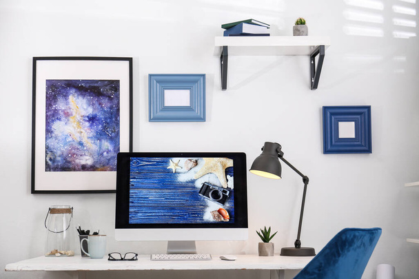Home workplace with modern computer and desk in room - 写真・画像