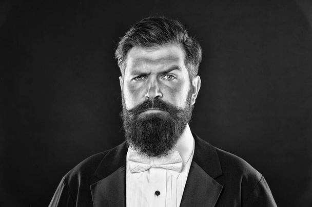 Barber shop concept. Grow mustache. Growing and maintaining moustache. Man bearded hipster with mustache. Beard and mustache grooming guide. Hipster handsome bearded attractive guy black background - 写真・画像