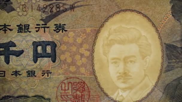 Egy japán jen bankjegy közelsége - Felvétel, videó
