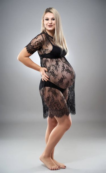 Happy young pregnant woman in a lace dress - Fotografie, Obrázek