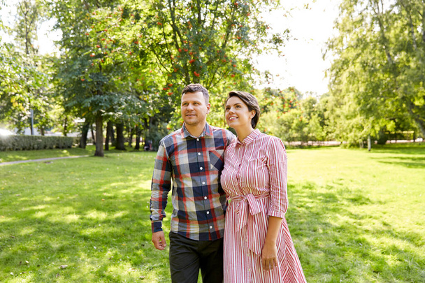 happy couple in summer park - Фото, изображение