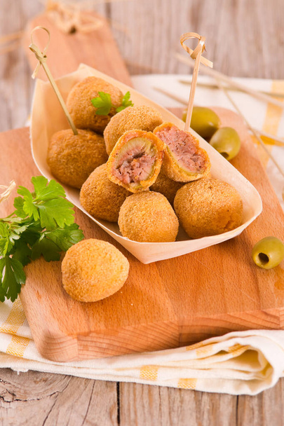 Ascoli stuffed olives on cutting board. - Photo, Image