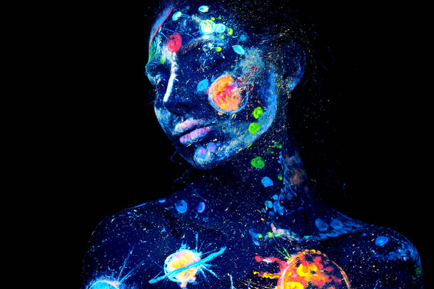 UV painting of a universe on a female halloween body portrait - Photo, Image