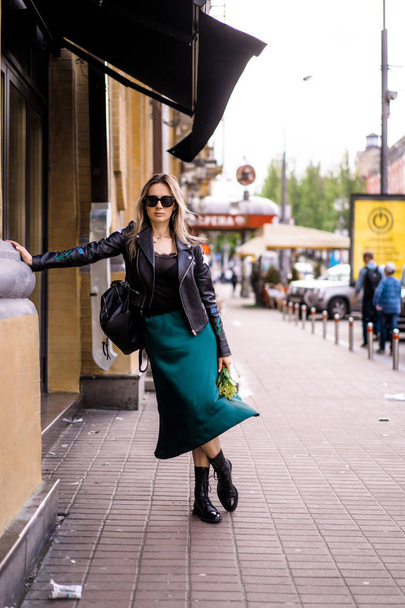 Young beautiful woman walks around the city in Europe, street photo, female posing in the city center - Fotografie, Obrázek