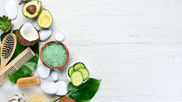 Natural Cosmetics: Avocado, coconut, sea salt and face cream. The concept of cosmetics and spa. Top view. Free copy space. - Foto, Imagem