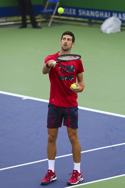 Serbian professional tennis player Novak Djokovic prepares for men's doubles of 2019 Rolex Shanghai Masters, in Shanghai, China, 7 October 2019.  - Фото, изображение