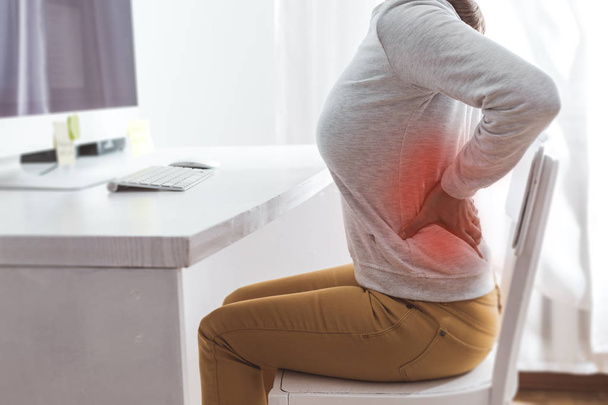 Kidney pain. Sick back in a woman from sedentary work. - Valokuva, kuva