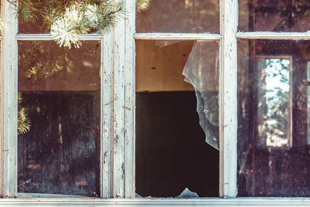 Broken windows of an old wooden house. - Photo, Image