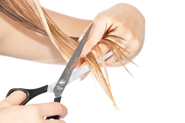 Woman cutting hair - Foto, imagen