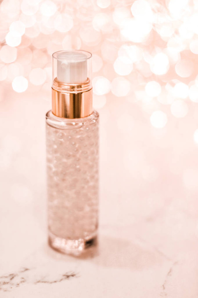 Holiday make-up base gel, serum emulsion, lotion bottle and rose - Photo, Image