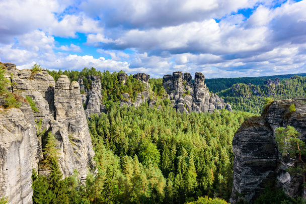 Bastei - View of beautiful rock formation in Saxon Switzerland National Park from the Bastei bridge - Elbe Sandstone Mountains near Dresden and Rathen - Germany. Popular travel destination in Saxony. - Fotoğraf, Görsel
