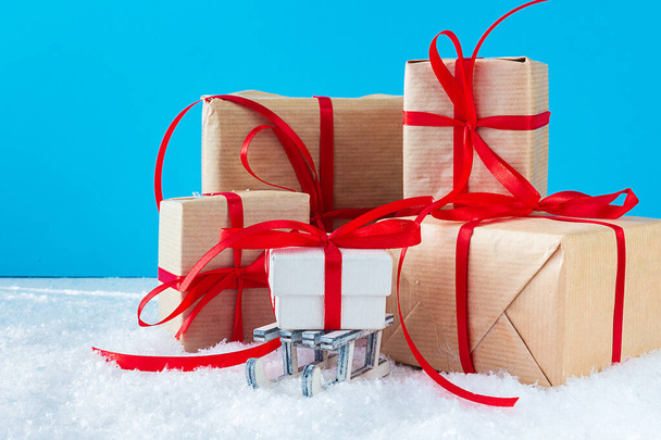 Christmas or New Year blue background with festive gift boxes. Holiday Christmas concept. - Fotó, kép