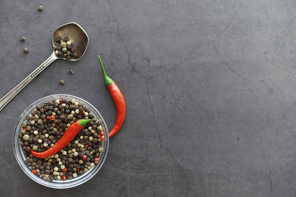 Hot red pepper. Chilean pepper on a black. - Zdjęcie, obraz