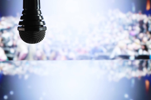The microphone on the stage in front of the hall. Performance on - Photo, Image