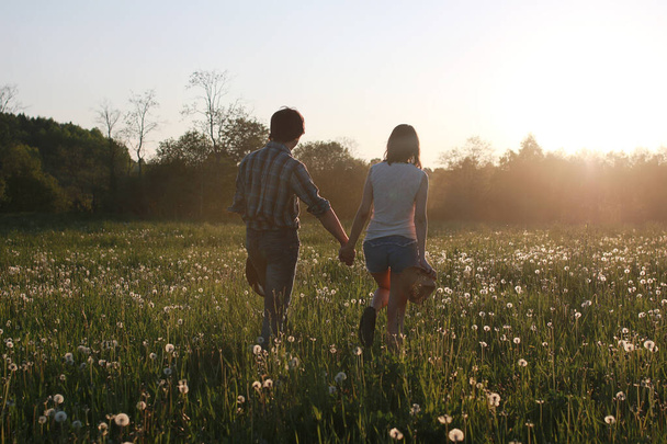 Cute couple on a walk by the countryside - Photo, image