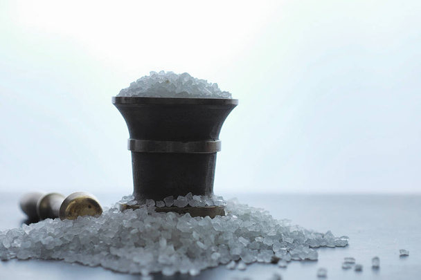 Large sea salt. Spice. Mortar and pestle for grinding. - Photo, Image
