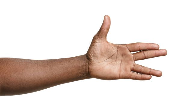 Afroamerikkalaisen miehen käsi valkoisella taustalla
 - Valokuva, kuva