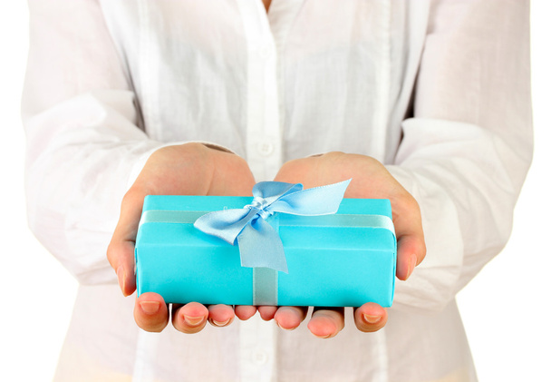 woman holds a box with a gift on white background close-up - Фото, изображение