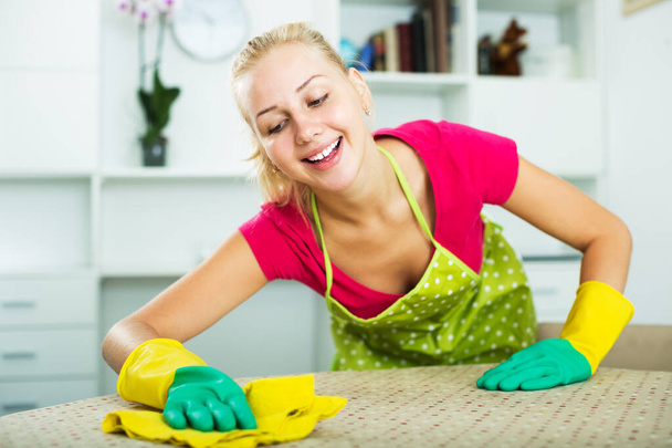 Woman wiping surfaces indoors - Foto, Imagem